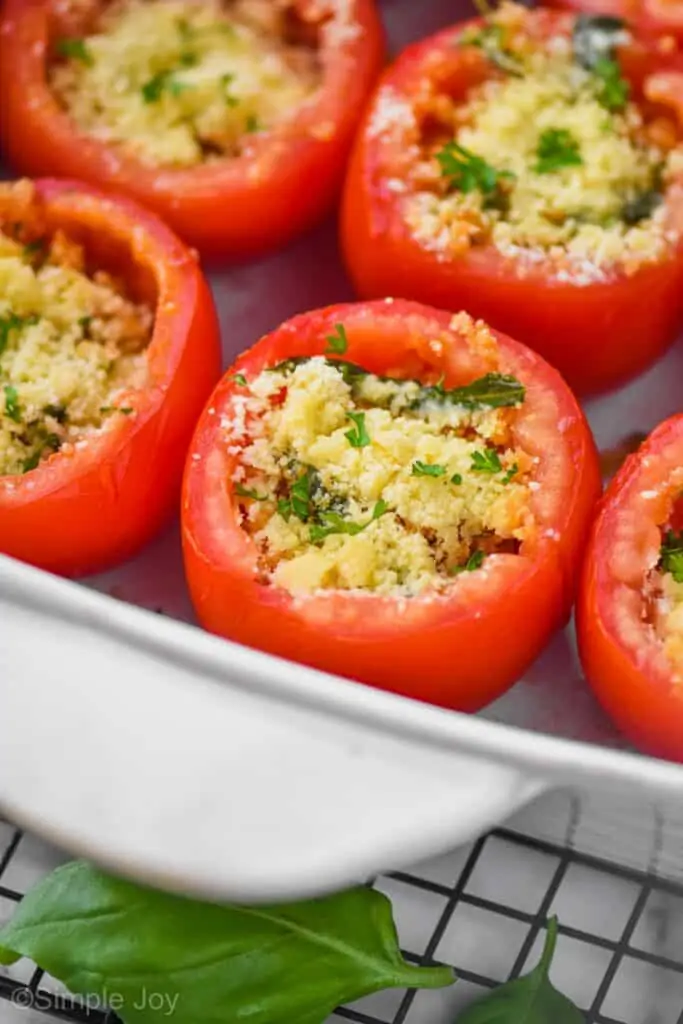 tomatoes filled with bread crumbs and cheese in a baking dish for stuffed tomatoes recipe