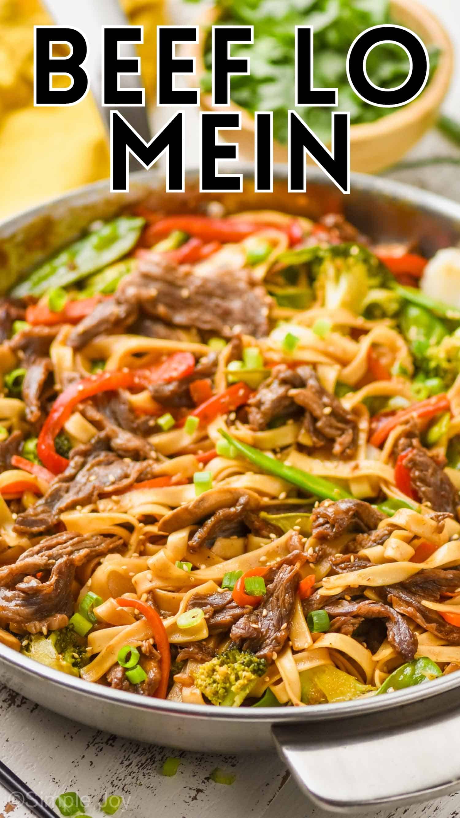 close up of a skillet full of beef lo mein