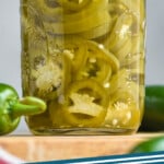 pinterest graphic of jar of pickled jalapeños, says: "pickled jalapeños simplejoy.com"