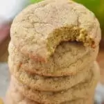stack of apple cookie recipe with the top cookie missing a bite