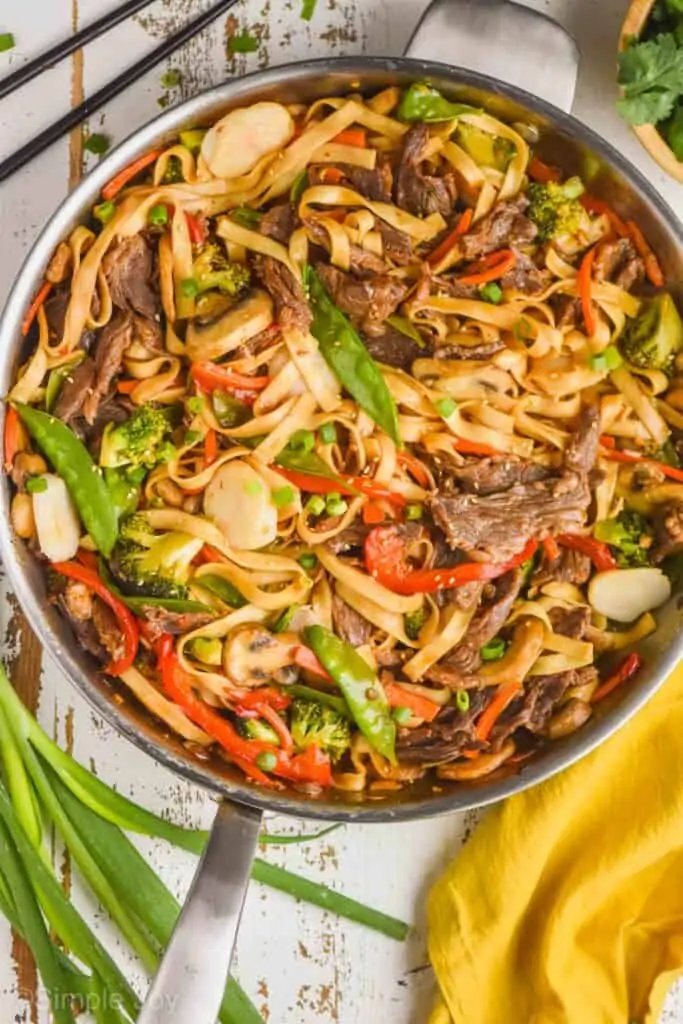 overhead of a skillet full of beef lo mein