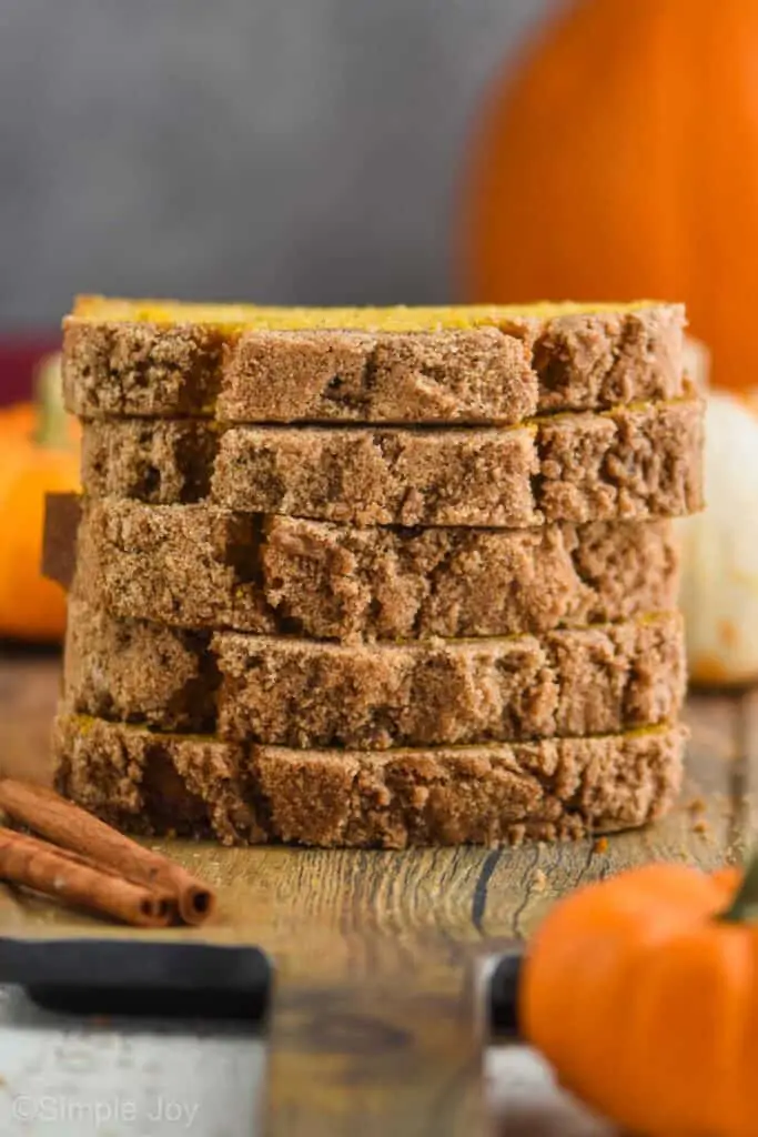 a stack of five pieces of the best pumpkin bread recipe