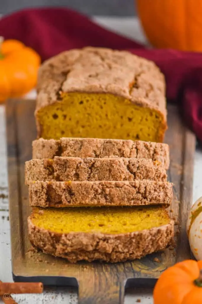 front of view of easy pumpkin bread sliced on cutting board