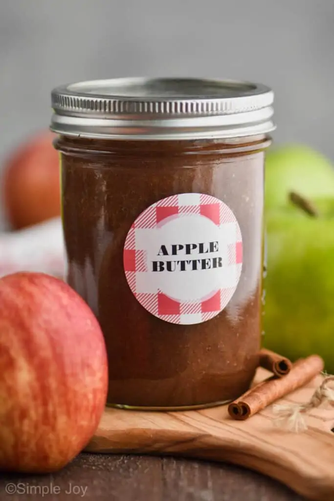 small mason jar with a label that says "apple butter"