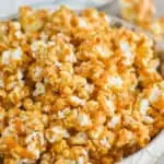 side view of a bowl of caramel corn