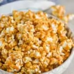 side view of a bowl of caramel corn