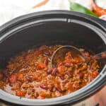 side view of a slow cooker full of easy crockpot chili