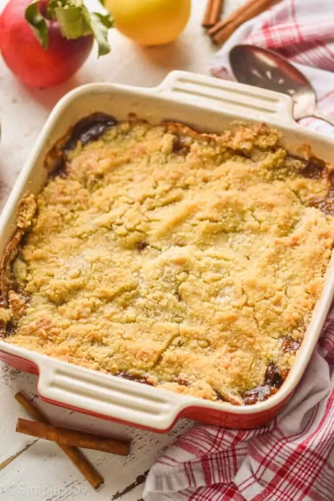 square baking dish holding apple crisp