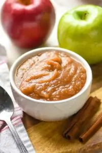 small white bowl full of applesauce