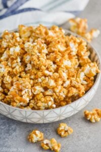 side view of a bowl of caramel corn