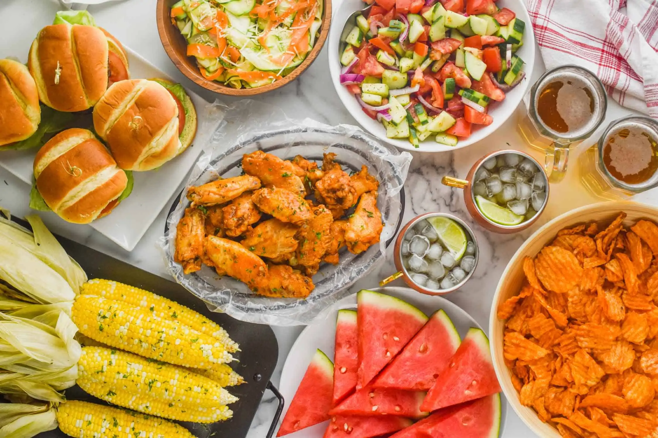 overhead view of table full of summer picnic food