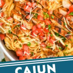 pinterest graphic of a close up overhead of cajun chicken alfredo in a skillet, says: "cajun chicken alfredo simplejoy.com"