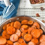 pinterest graphic of candied sweet potatoes in a skillet, says "candied sweet potatoes simplejoy.com"