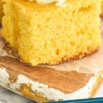 pinterest graphic of close up of a piece of cornbread with butter and honey on it