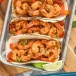 Pinterest graphic of overhead of three shrimp fajitas