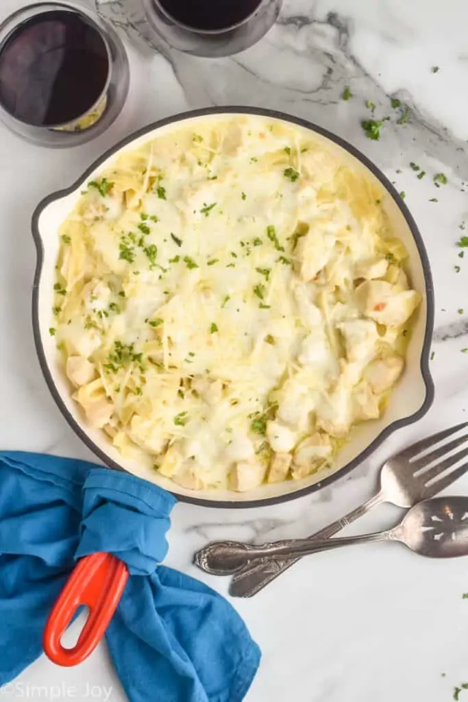 overhead of a skillet of Alfredo chicken casserole