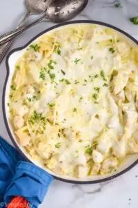 overhead of a skillet of Alfredo chicken casserole