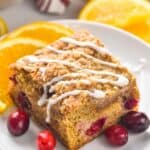 piece of cranberry orange coffee cake that has had icing drizzled across the top of it - 5