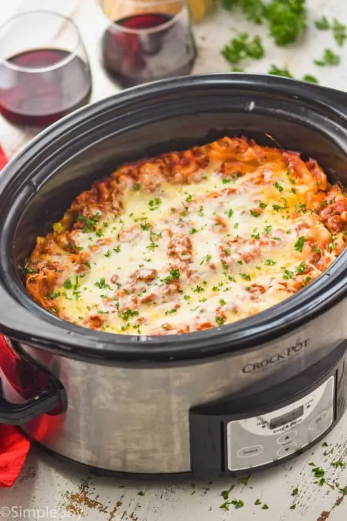 side view of a slow cooker full of crockpot lasagna