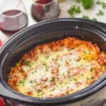 side view of a slow cooker full of crockpot lasagna