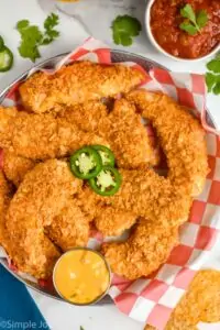 overhead view of a basket of chicken tenders made with crushed chips