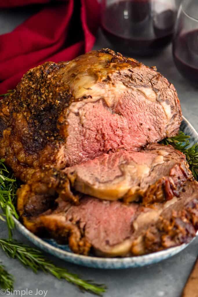 a prime rib cooked and cut on a serving platter