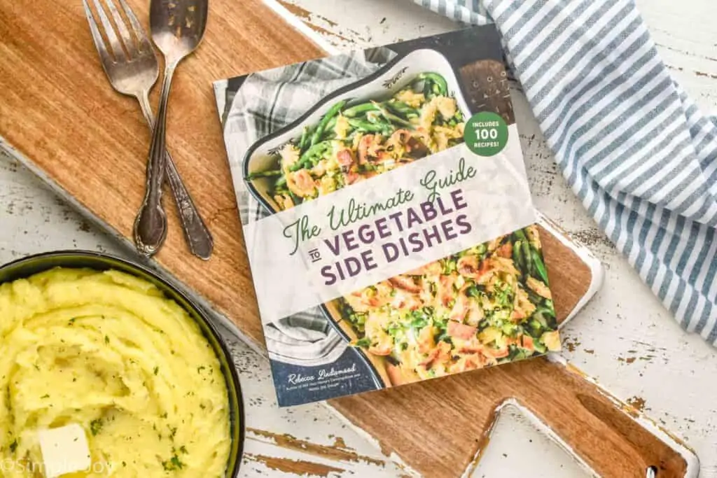 overhead view of vegetable side dishes cookbook on a cutting board