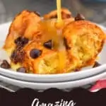 brown sugar sauce being poured over a piece of croissant bread pudding recipe on a small white plate