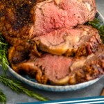 pinterest graphic of a prime rib that has been sliced, says: "prime rib recipe, simplejoy.com"