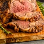 pinterest graphic of prime rib roast on a cutting board, says: "super easy prime rib recipe, simplejoy.com"