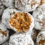 close up of a rum ball that has a bite taken out of it
