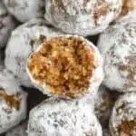 close up of a rum ball that has a bite taken out of it
