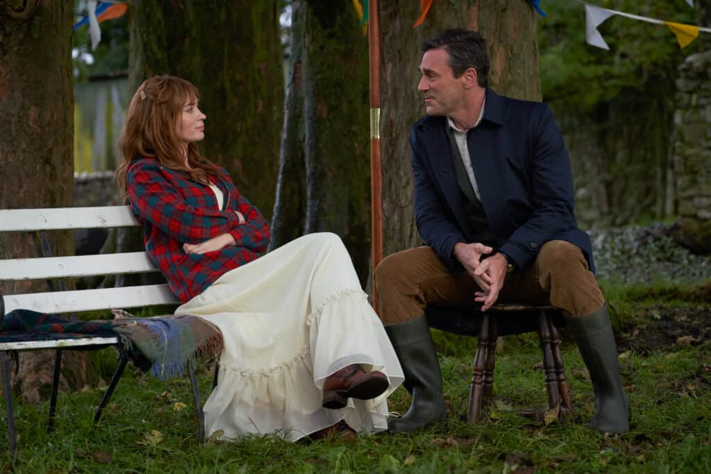 still frame from movie wild mountain thyme featuring Emily blunt and John Hamm sitting outside