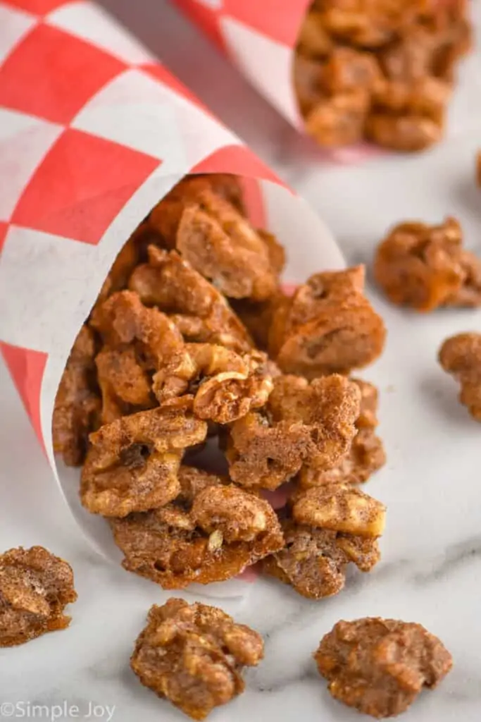 candied walnuts wrapped in checked paper made into a cone