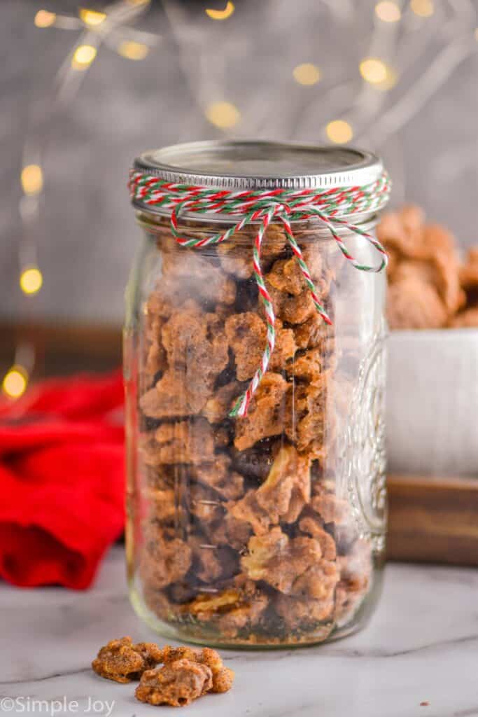 candied walnuts in a mason jar tied with a ribbon