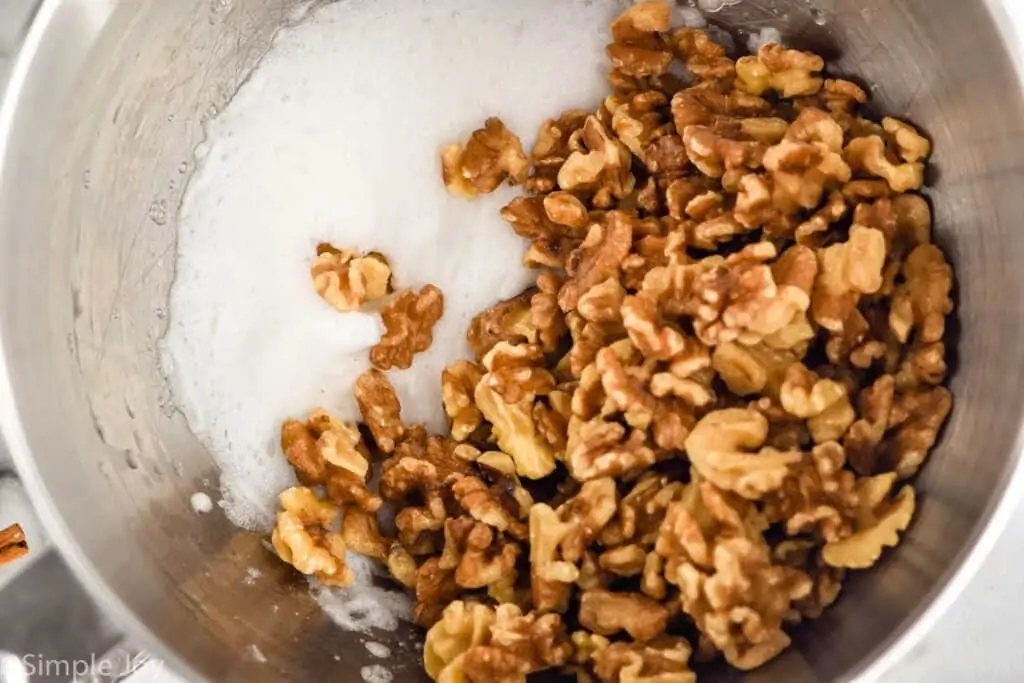 overhead view of walnuts in beaten egg whites