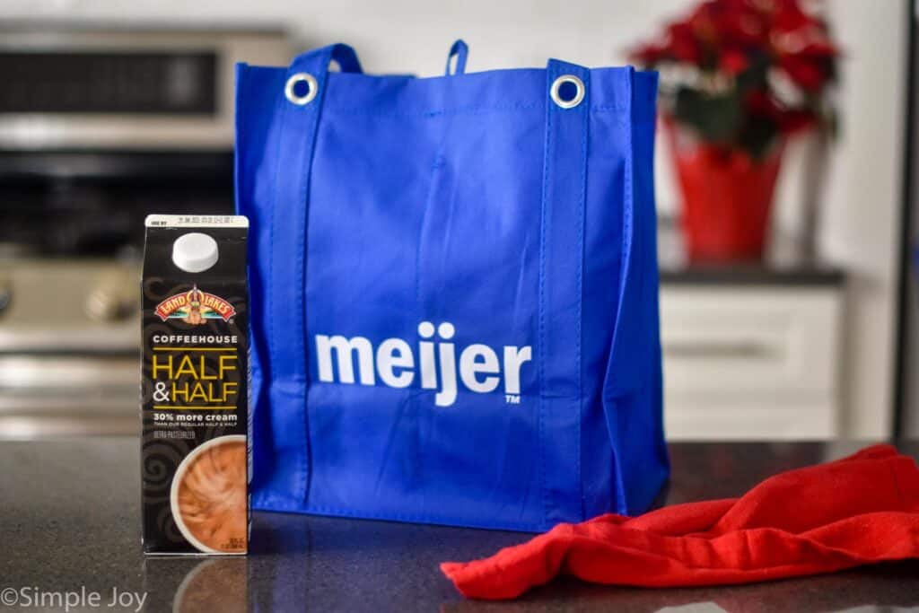 a reusable Meijer bag next to a carton of land o lakes coffee house half and half