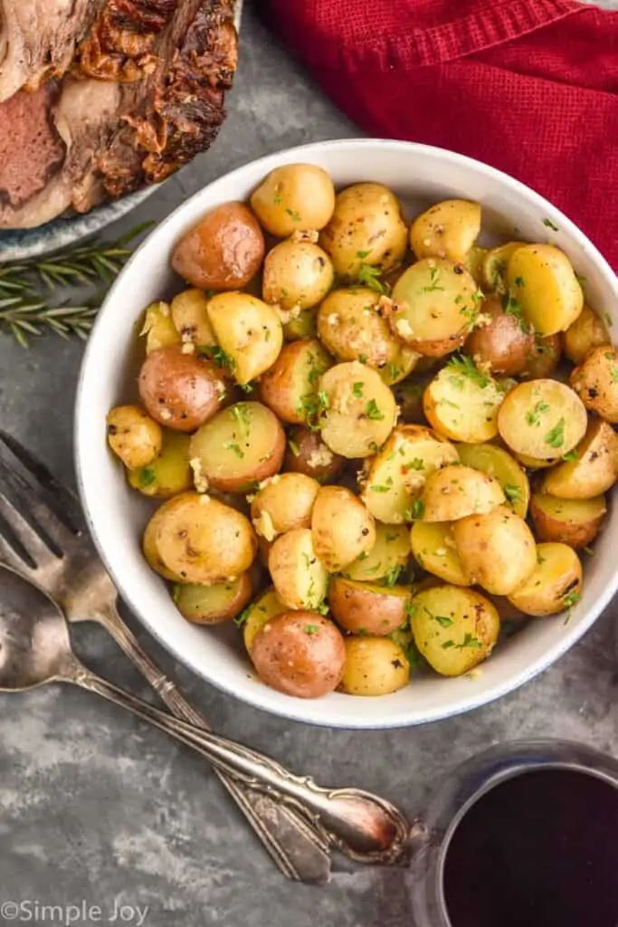 overhead view of roasted baby potatoes in a serving bowl