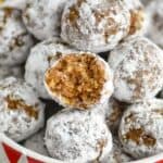 close up of a rum ball that has a bite taken out of it - 17