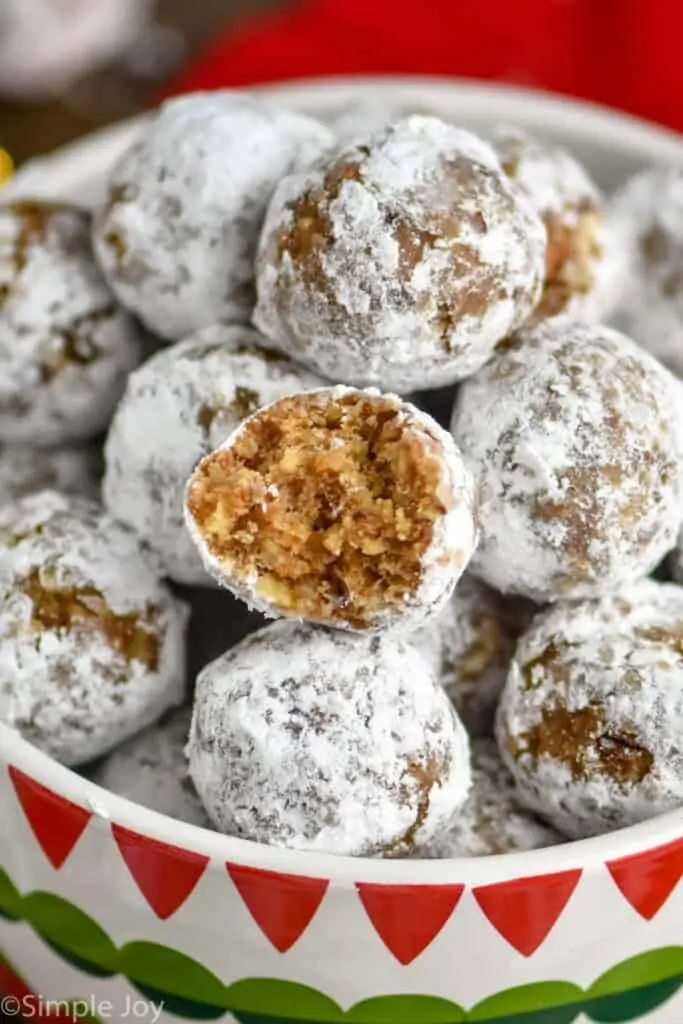 close up of a rum ball that has a bite taken out of it