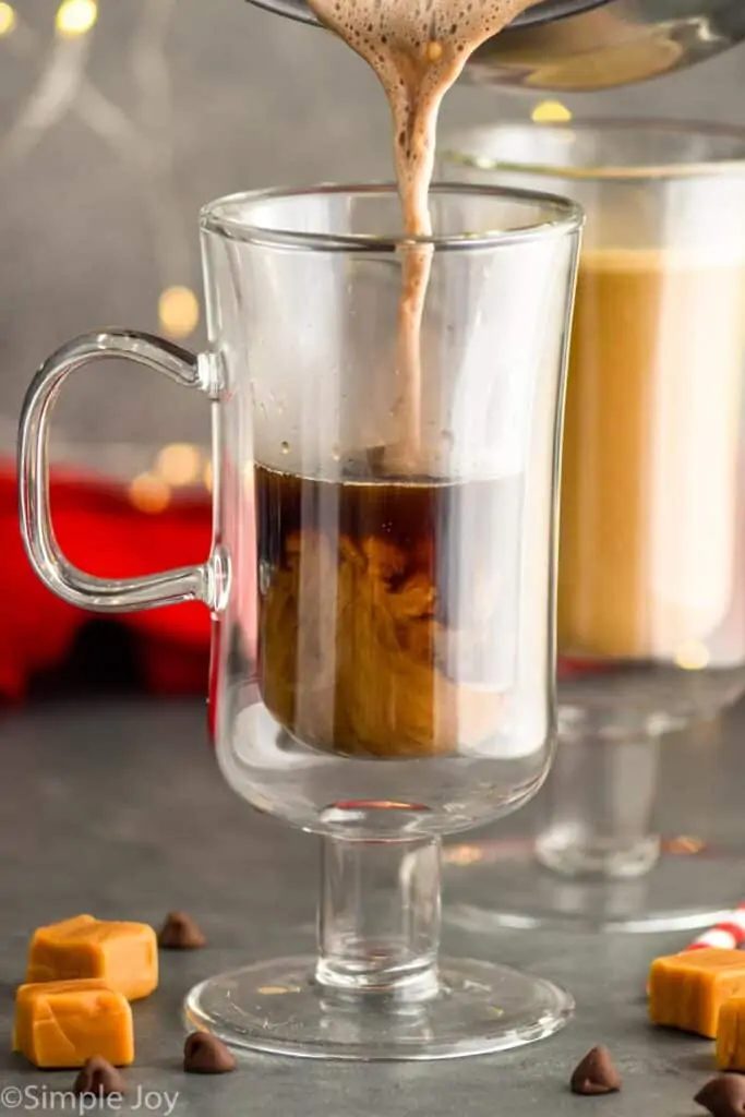 half and half mixture being poured into a glass for salted caramel mocha