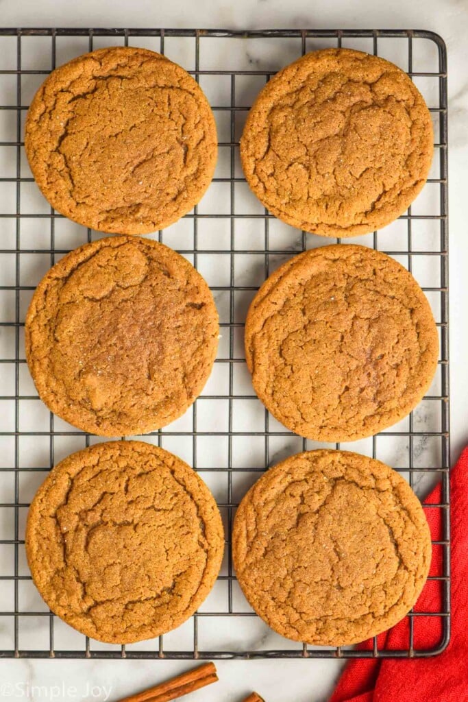 overhead of six molasses cookies on cooling rack