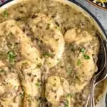 close up of a skillet full of chicken with cream of mushroom soup