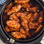 overhead view of chicken wings in air fryer - 8