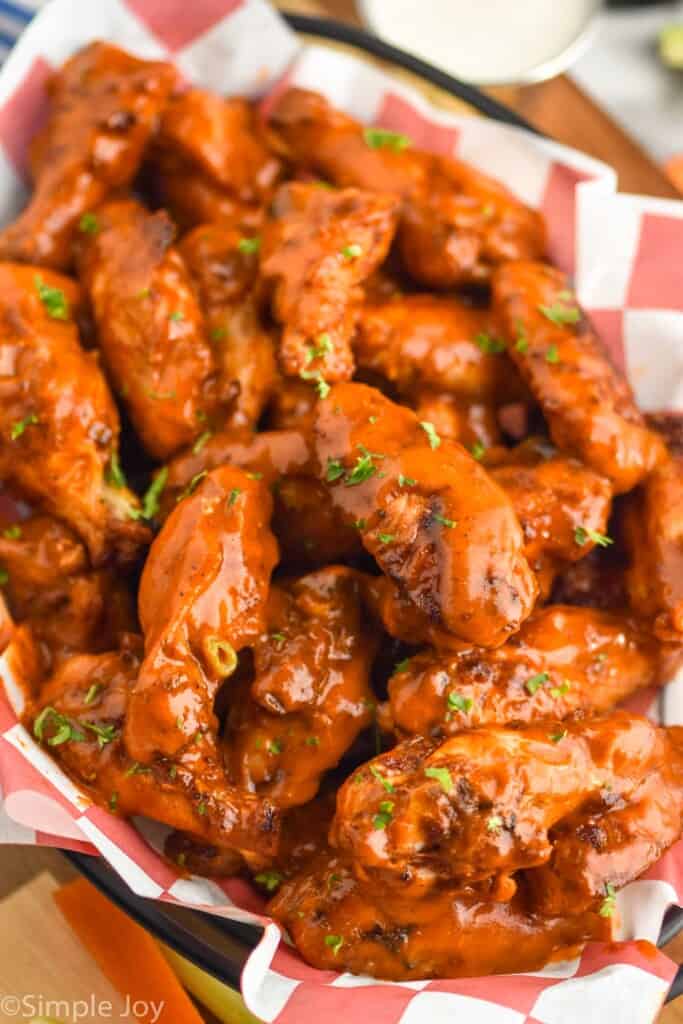 side view of a basket of chicken wings