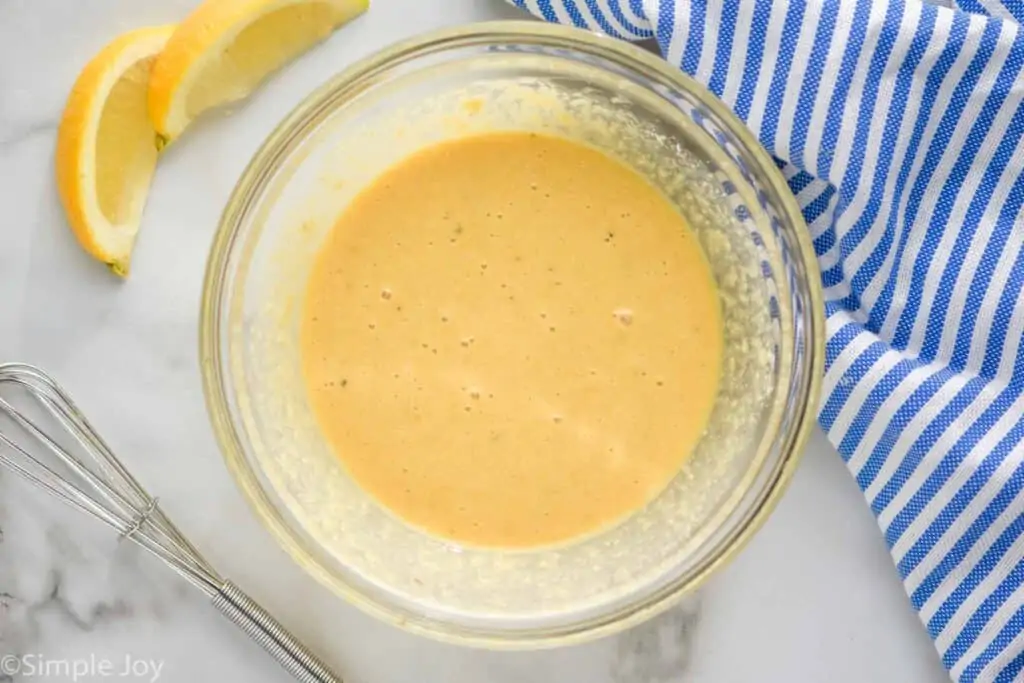 bowl of Caesar salad dressing after the Parmesan cheese has been mixed in