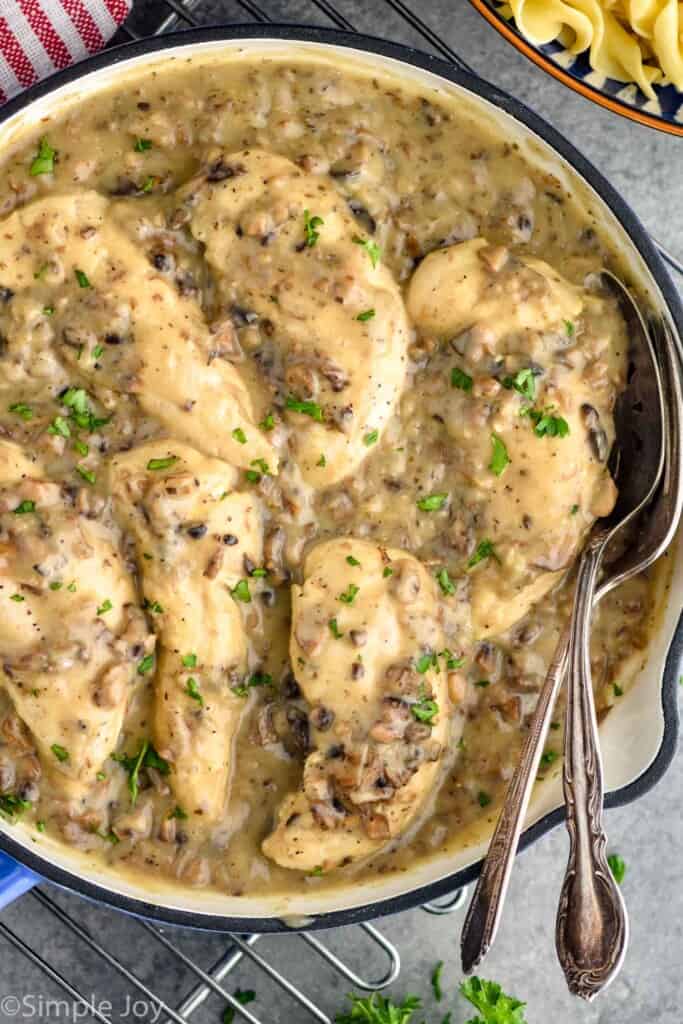 close up of a skillet full of chicken with cream of mushroom soup