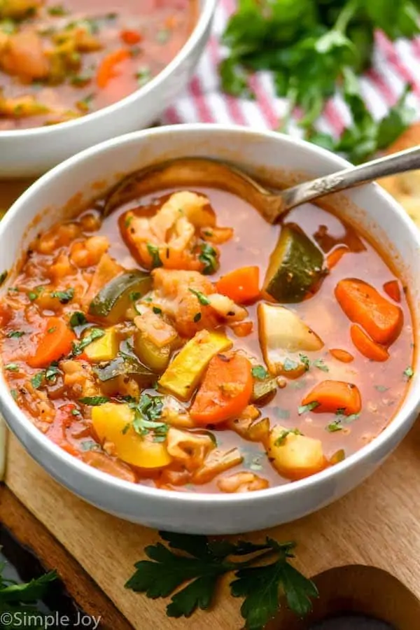 close up of a white bowl full of instant pot vegetable soup