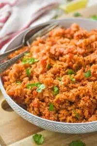 a bowl of Spanish rice garnished with cilantro