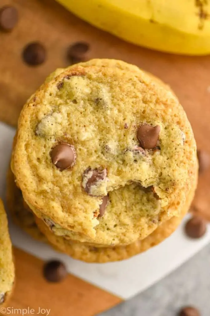 overhead view of a stack of cookies with a bite missing